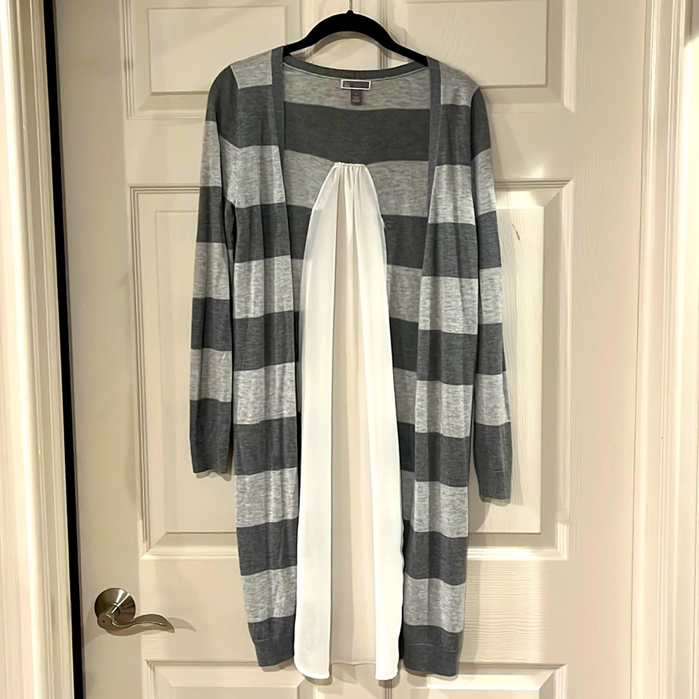 Women’s unique lightweight cardigan with sheer fabric back.